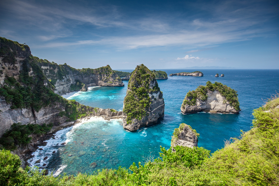 Scenic Bali beach with stone structures in the water